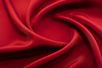 A piece of burgundy, red cloth. Fabric texture for background and design works of art, beautiful...
