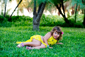 Naklejka na ściany i meble girl relaxing on the grass