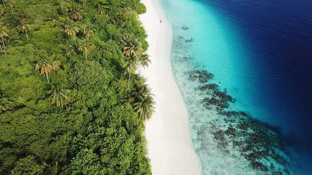 Aerial view of tropical island, Maldives. High quality 4k footage