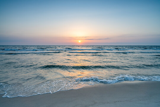 Beautiful sunset at the beach - Powered by Adobe
