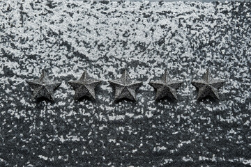 The best rating, Feedback, Customer Experience Concept. Five silver star on glitter silver background. Five star excellent rating on grey background