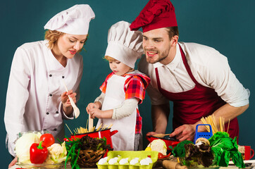 Family cooking together at kitchen. Family relationships. Healthy lifestyle. Advertising. Restaurant.