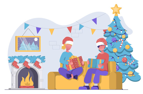 A man and woman sit on couch next to fireplace and Christmas tree and open Christmas presents