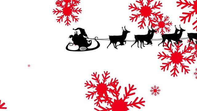 Santa claus in sleigh being pulled by reindeers against red snowflakes falling on white background