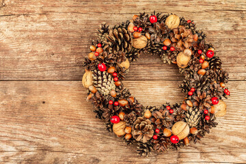 Autumn wreath of cones, nuts, and berries. Creative composition, the handmade
