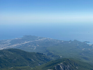 Beautiful view of the sea and mountains. A bird`s-eye view of the rocky coast. Top view