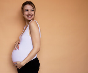 Portrait of the young pregnant woman