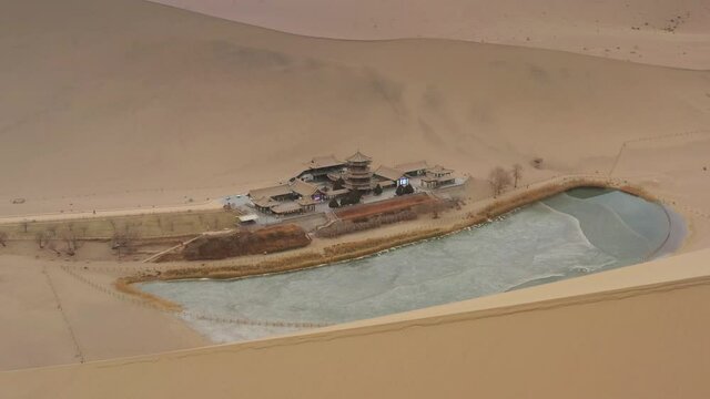 sunny evening time desert dunes old town pond aerial panorama 4k gansu china