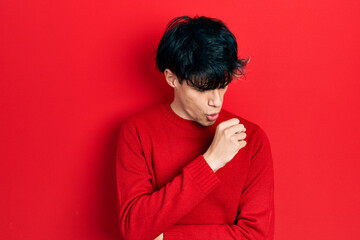Fototapeta na wymiar Handsome hipster young man wearing red winter sweater feeling unwell and coughing as symptom for cold or bronchitis. health care concept.