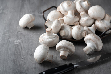 Raw fresh mushrooms on a wooden table