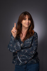 portrait of a woman, one hand signal