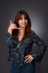 portrait of a woman, call me hand signal