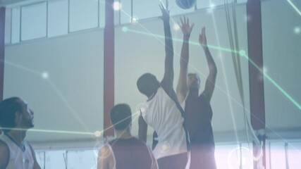 Animation of networks of connections over group of diverse basketball players at gym - Powered by Adobe