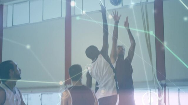 Animation of networks of connections over group of diverse basketball players at gym