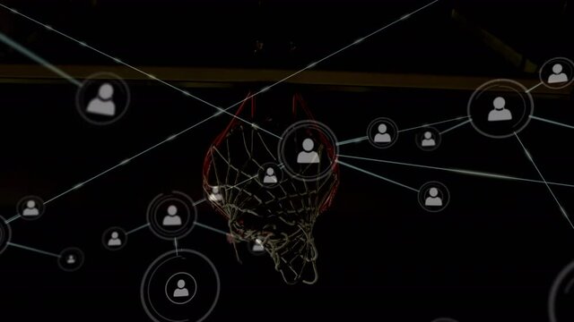 Animation of networks of connections over mixed race male basketball player at gym