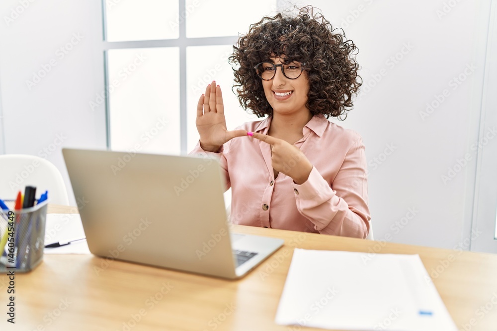 Sticker Young middle east woman having video call communicating with deaf language at office