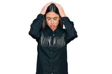 Young hispanic woman wearing casual clothes suffering from headache desperate and stressed because pain and migraine. hands on head.