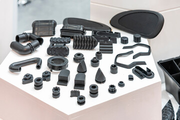 Various compression molded rubber sample parts made from manufacturing process in industrial e.g. plug cover cap pipe tube pedal nozzle connector and automobile parts other - obrazy, fototapety, plakaty