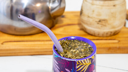 close view of a yerba mate infusion on top of a white table