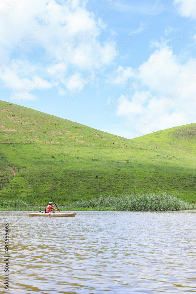 Wall mural Kayak fishing on the Muriaé river, east of Minas Gerais, Brazil.