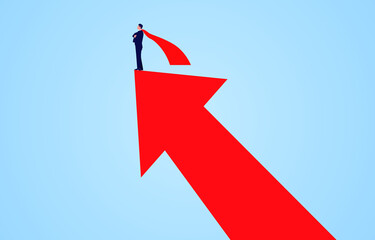 Successful businessman wearing red cape standing on upward growing red arrow.