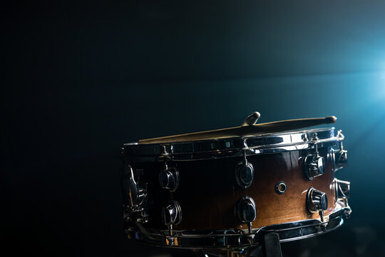 Snare drum on a black background, musical instrument, musical concept. - Powered by Adobe