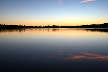 Obraz na płótnie Canvas sunset over quiet lake