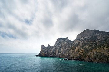 Fototapeta na wymiar Stone cliff in the sea. Beautiful cliff.