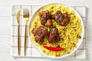 roasted meat served with raisins saffron rice