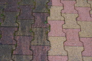 Contrast between dirt old auto block slab paving slabs floor dirty clean pressured washed concrete...