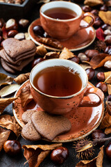 Composition with tea cup and  cookies on wooden table