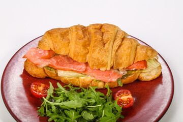 Croissant with salmon for breakfast