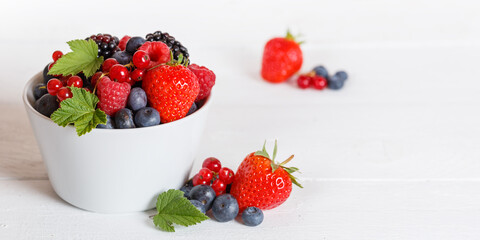 Berries fruits berry fruit strawberries strawberry blueberries blueberry on wooden board copyspace...