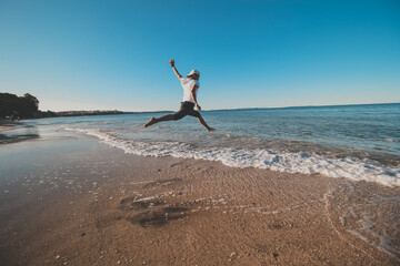 
Asian man taking a photo shoot at campbells bay beach, Auckland, New Zealand