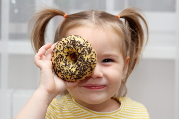 little child eating a donut
