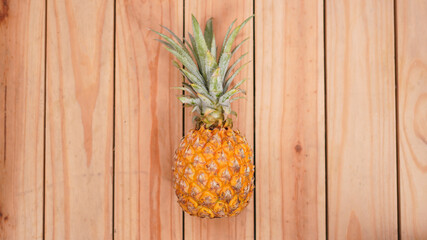 pineapple fruit on wooden background
