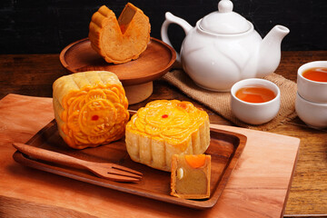 Mooncakes Stir Fried Durian Filling with Salted Egg Yolk and hot tea Asian Festival