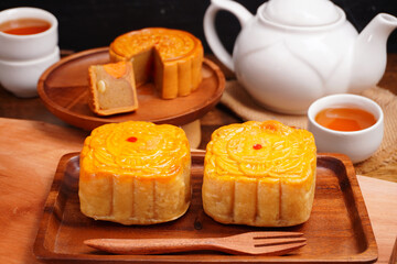 Mooncakes Stir Fried Durian Filling with Salted Egg Yolk and hot tea Asian Festival