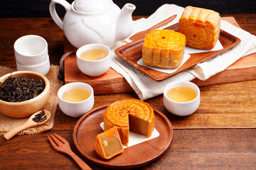 Mooncakes Stir Fried Durian Filling with Salted Egg Yolk and hot tea Asian Festival