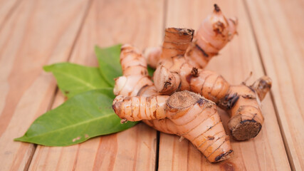 galangal spice and bay leaf on wooden table