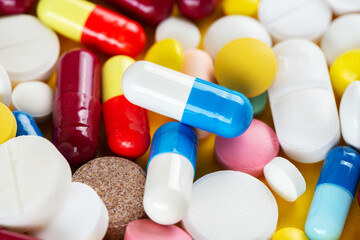 Background from colorful pills and capsules. Pharmaceutical industry concept. Pharmacy. Antibiotic resistance.
