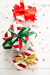 Christmas banner with gift boxes and sparkling glitter on white background