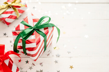 Christmas banner with gift boxes and sparkling glitter on white background