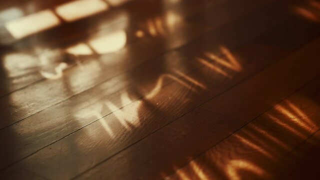 shadows of curtains swinging on the wooden floor