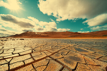 Cracked earth at the site of a dried  lake. Global climate change concept