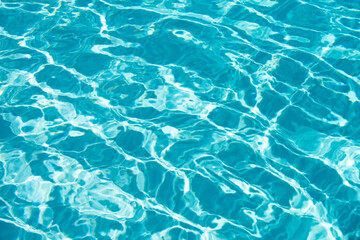 Abstract ripple wave and clear turquoise water surface in swimming pool, blue water wave for...