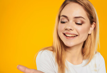 cheerful woman in a white attractive look happy Lifestyle yellow background