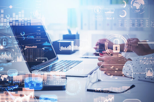 Side view of working businesspeople with laptops, desk at office, white glowing information protection icons. Padlock and business symbols. Concept of cyber security and data storage