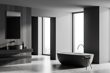 Obraz na płótnie Canvas Dark grey bathroom with on trend oval bathtub and concrete floor