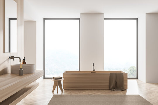 White bathroom with rectangular wood look bathtub